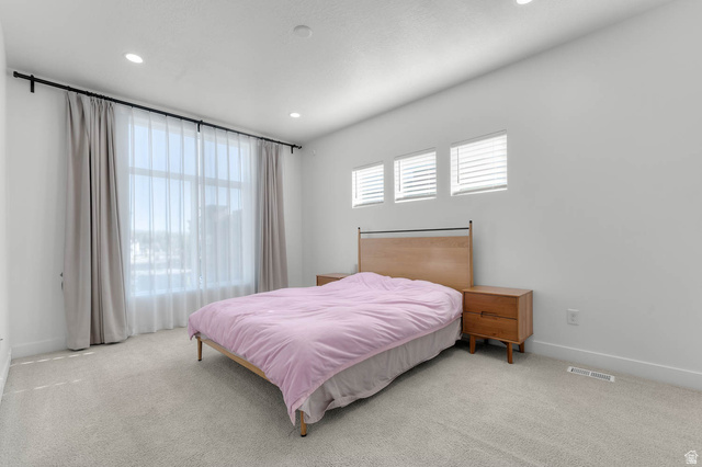 8307 Durham Street Sandy, UT 84070 - Photo 18 of 29 Carpeted bedroom with a large window featuring sheer and blackout curtains