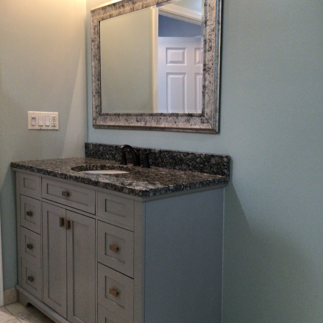 Undisclosed Address Chicago, IL 60642 - Photo 14 of 24 a bathroom with a granite countertop sink and a mirror