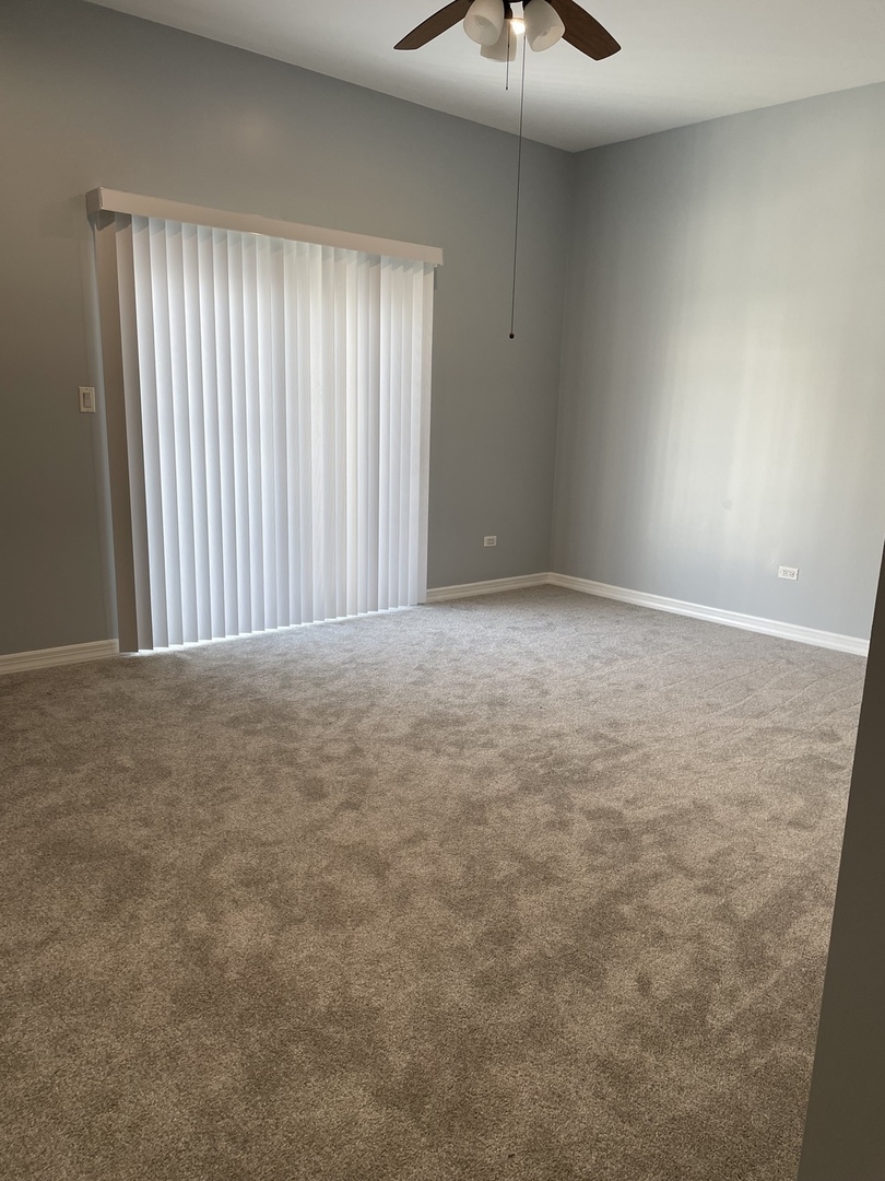 Undisclosed Address Chicago, IL 60642 - Photo 19 of 24 a view of an empty room with a window