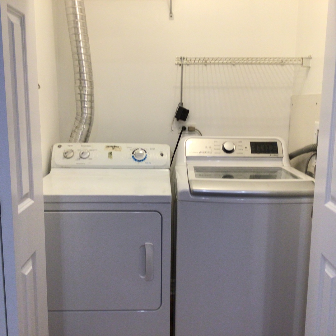 Undisclosed Address Chicago, IL 60642 - Photo 8 of 24 a utility room with dryer and washer