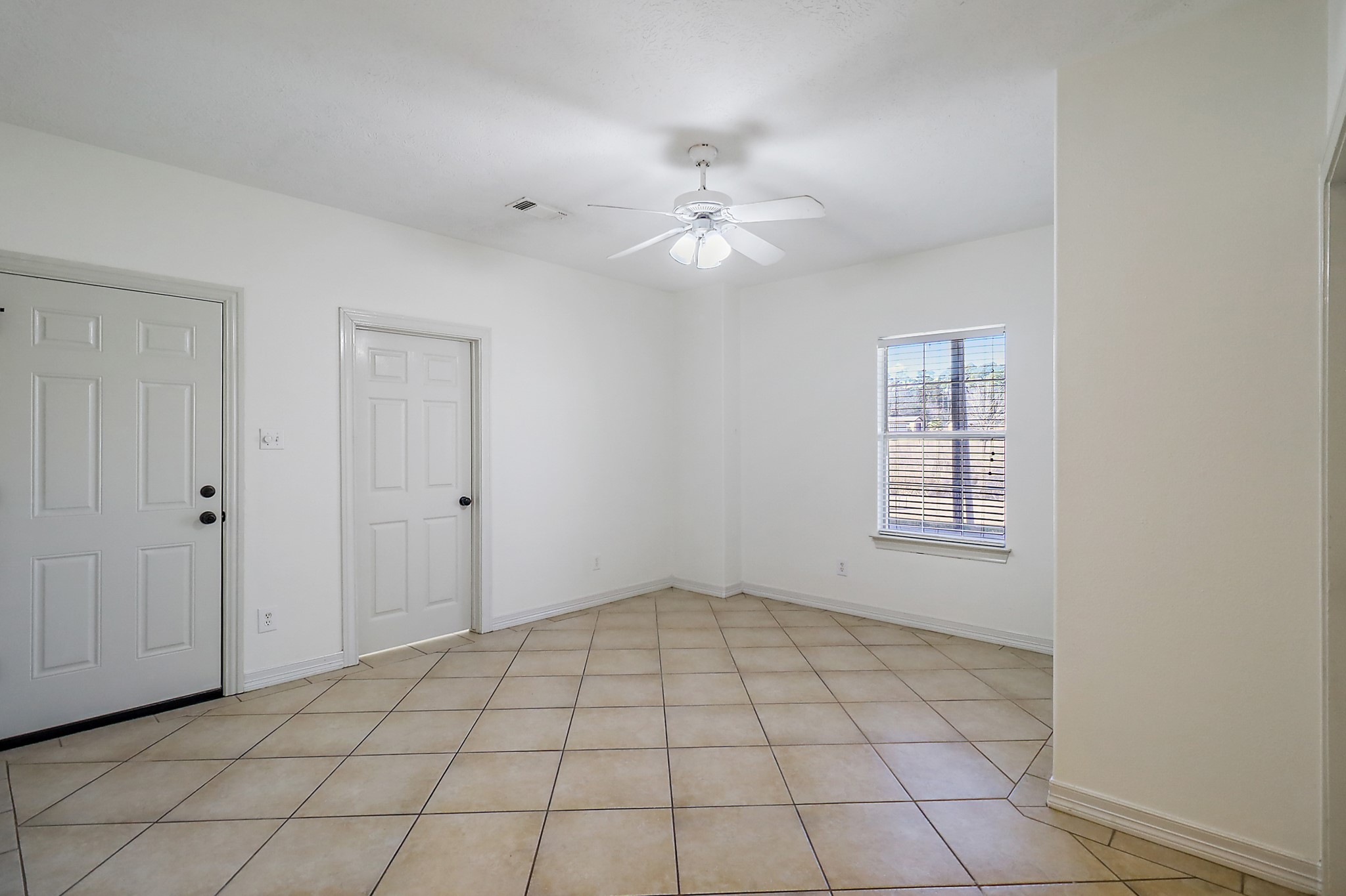1306 Spring Branch Drive Baytown, TX 77523 - Photo 16 of 38 a view of an empty room and window