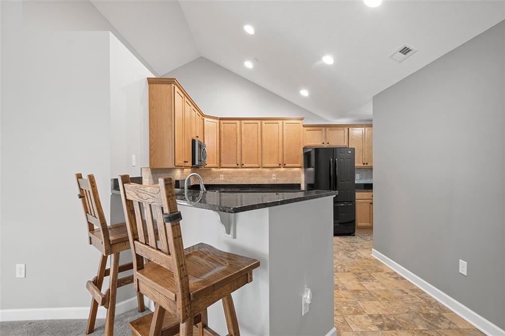 2002 Southview Drive Harmony, PA 16037 - Photo 22 of 47 a kitchen with stainless steel appliances granite countertop a sink and a refrigerator