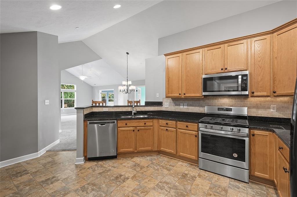2002 Southview Drive Harmony, PA 16037 - Photo 24 of 47 a kitchen with stainless steel appliances granite countertop a stove top oven a sink and a microwave