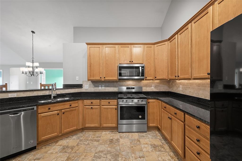 2002 Southview Drive Harmony, PA 16037 - Photo 27 of 47 a kitchen with stainless steel appliances granite countertop a sink stove and microwave