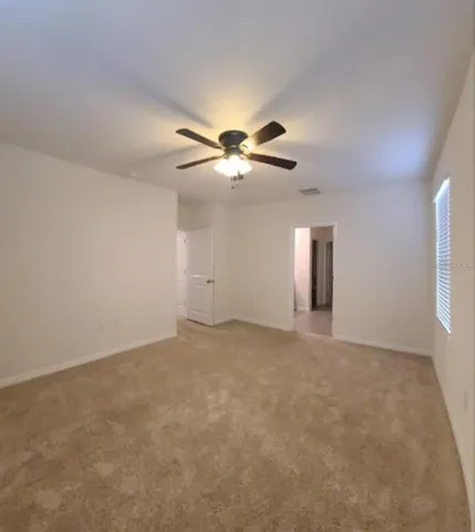 en view of an empty room with a window