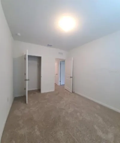 a view of a room with an empty space