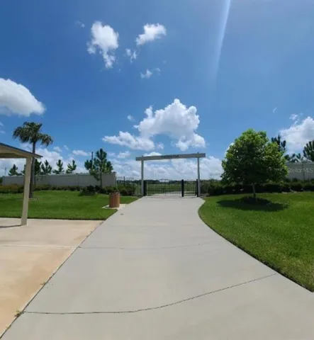 a view of swimming pool with seating space