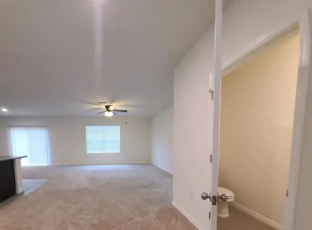 a view of a livingroom and a window
