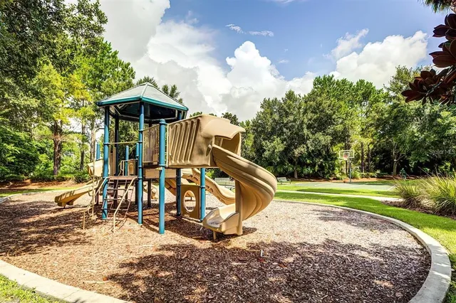an aerial view of a swimming pool patio and outdoor seating