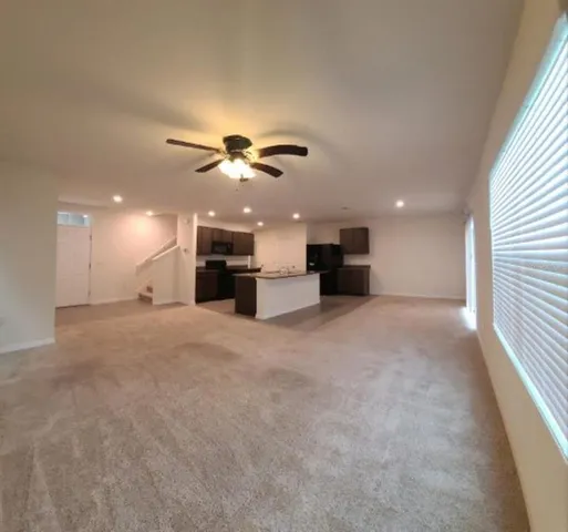 a view of a kitchen with a sink and a chandelier