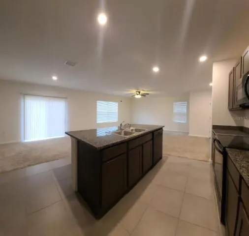 a kitchen with a stove and a sink