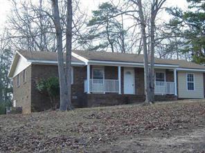 4293 Huntington Farm Road Catawba, SC 29704 - Photo 1 of 5 a front view of a house with garden