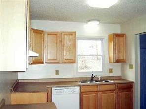4293 Huntington Farm Road Catawba, SC 29704 - Photo 3 of 5 a kitchen with a sink a window and cabinets