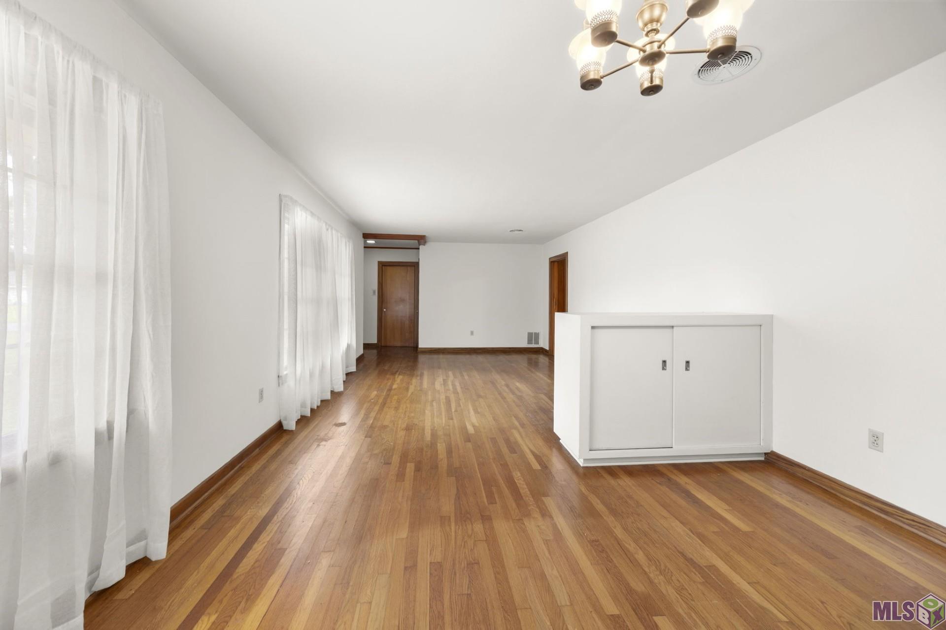 9372 Woodbine Street Baton Rouge, LA 70815 - Photo 4 of 23 Reverse Dining Room and Living Room