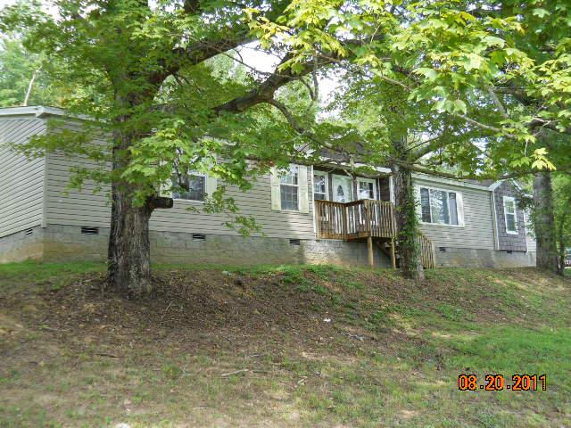 988 Coaling Road Charlotte, TN 37036 - Photo 1 of 19 FRONT HAS NICE VIEW AND SHADE TREES