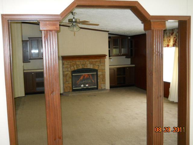 988 Coaling Road Charlotte, TN 37036 - Photo 12 of 19 DEN WITH FP AND BOOKSHELVES OFF DINING ROOM