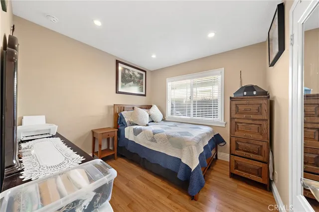 a bedroom with bed and a window