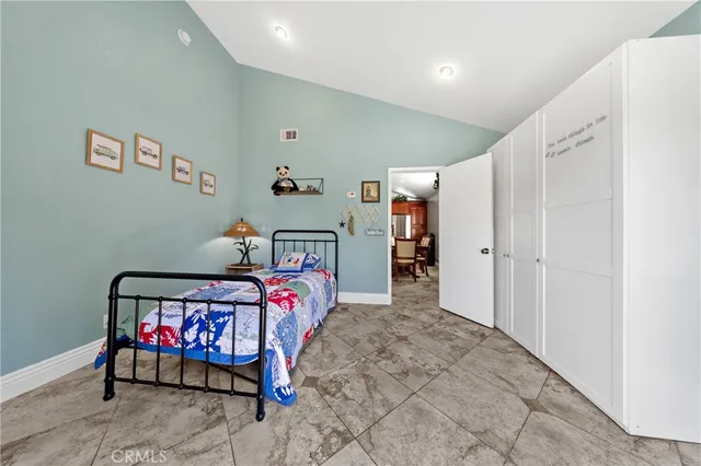 a bedroom with furniture and window