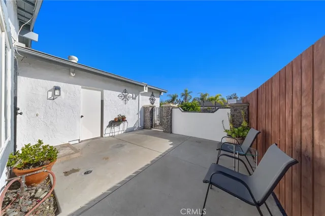 a balcony with table and chairs