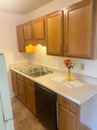 151 Boone Street, Unit G104 Pensacola, FL 32505 - Photo 6 of 7 a bathroom with a sink and a mirror