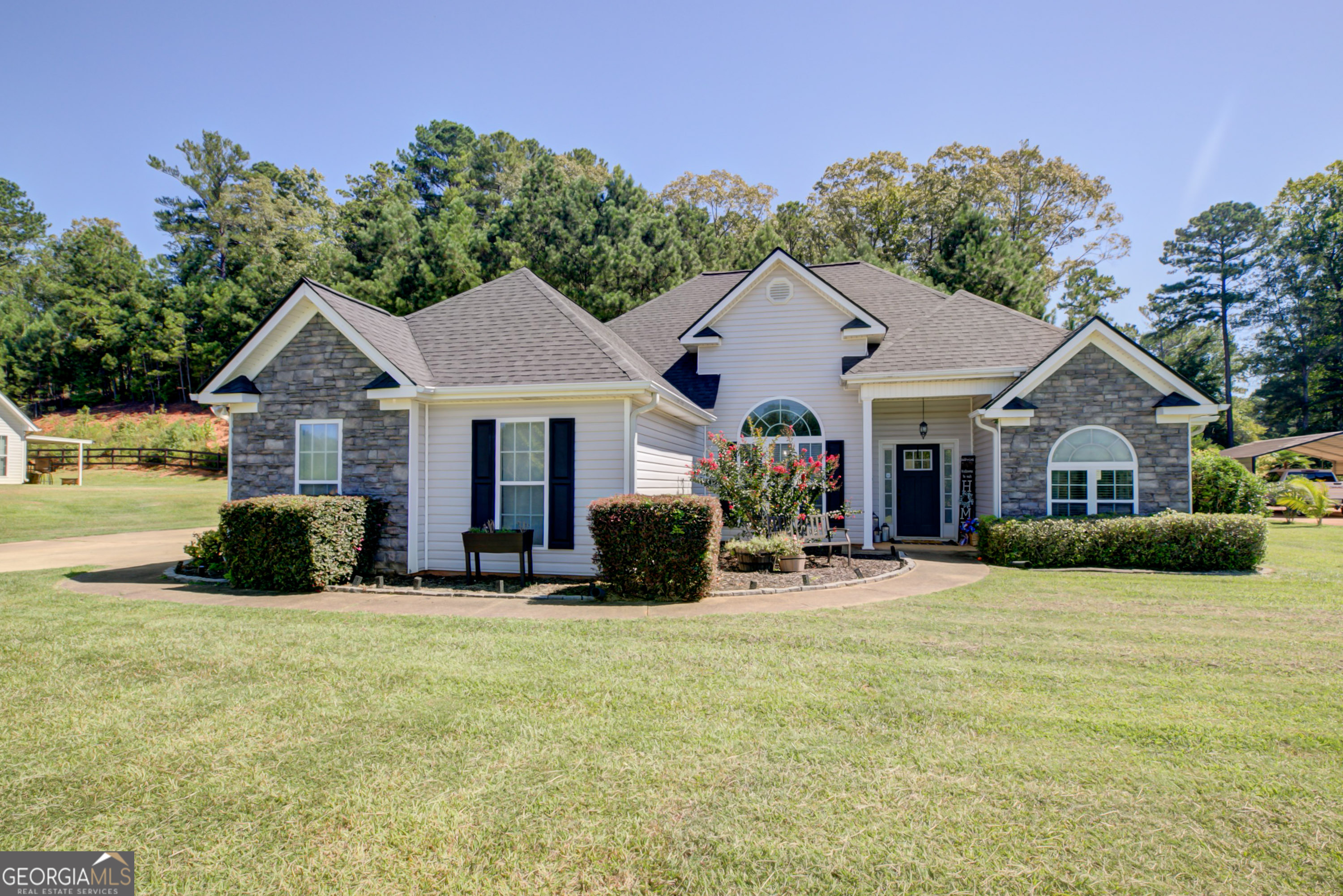 229 John Lovelace Road LaGrange, GA 30241 - Photo 1 of 59 a front view of a house with yard and green space