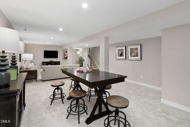 a view of a livingroom with furniture and a flat screen tv