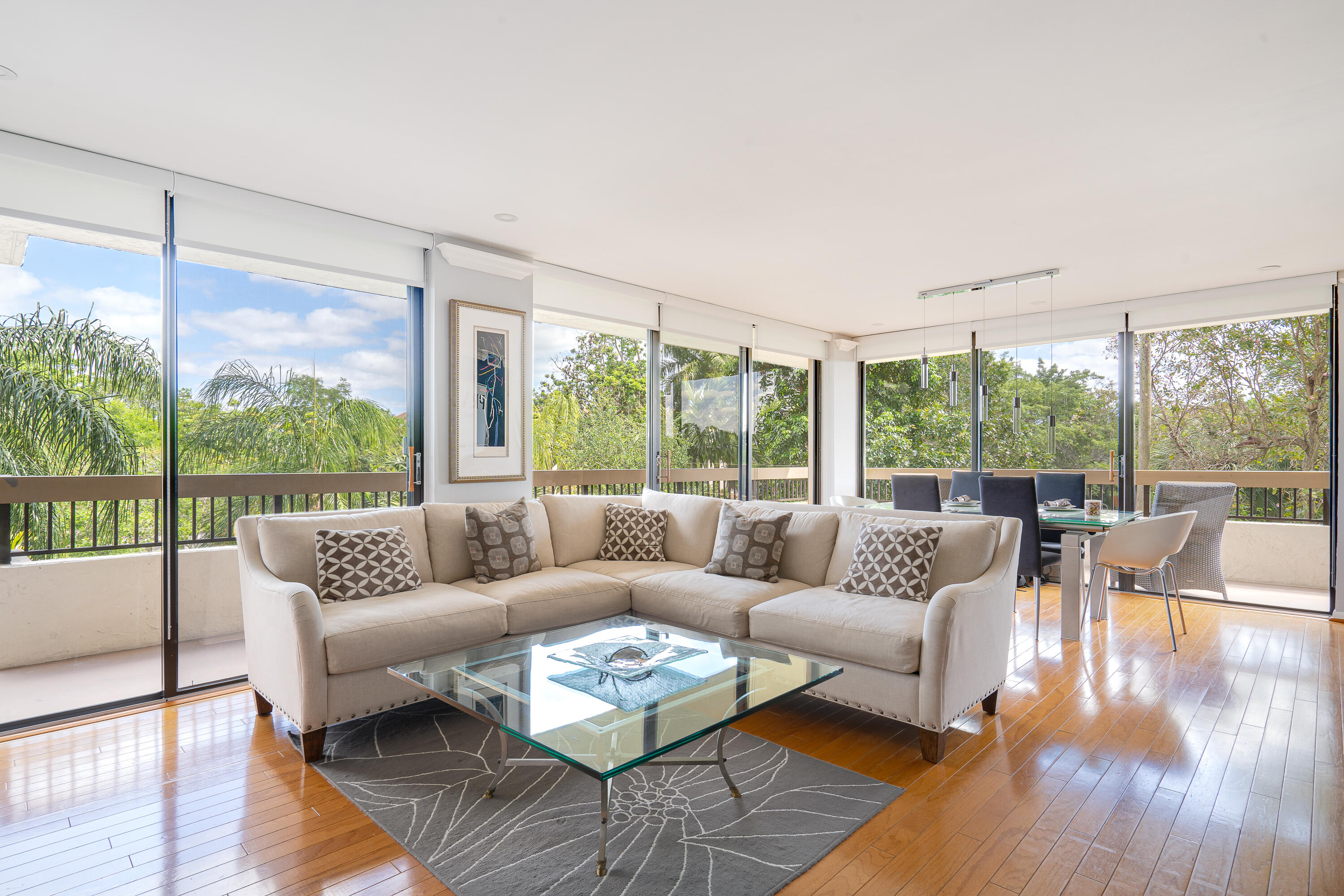 23200 Camino Del Mar, Unit 301 Boca Raton, FL 33433 - Photo 1 of 22 a living room with furniture and a large window