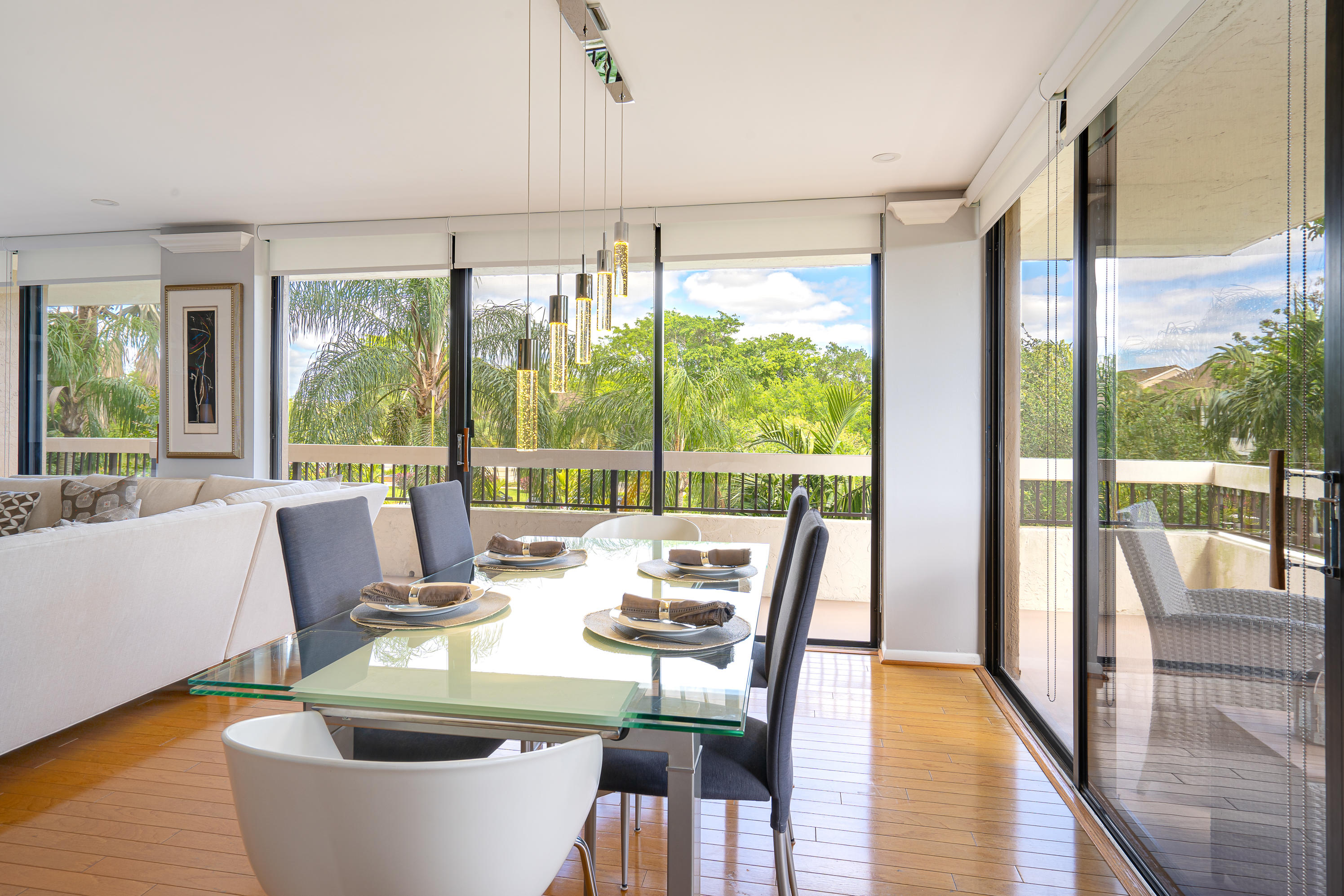23200 Camino Del Mar, Unit 301 Boca Raton, FL 33433 - Photo 2 of 22 a view of a dining room with furniture window and wooden floor