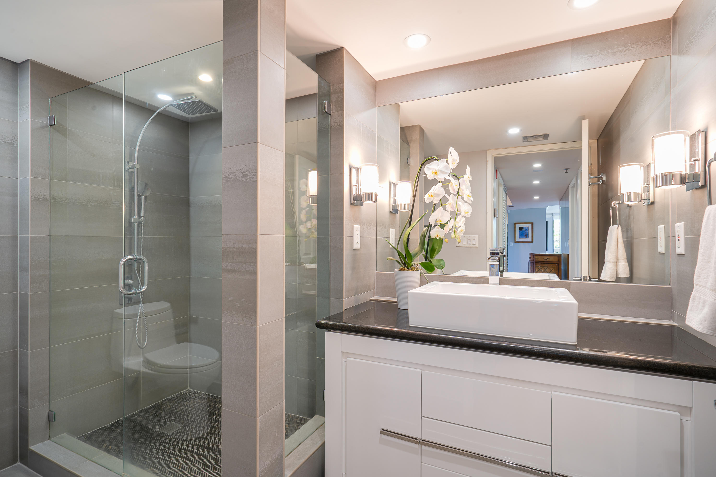 23200 Camino Del Mar, Unit 301 Boca Raton, FL 33433 - Photo 6 of 22 a bathroom with a sink a toilet and shower