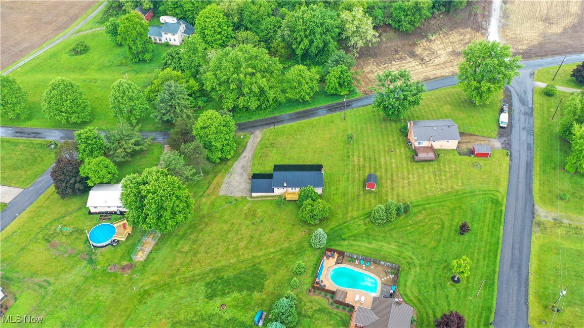 23595 Sandy Creek Road Minerva, OH 44657 - Photo 30 of 32 Drone / aerial view of a pool area