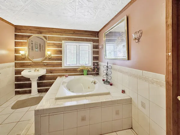 a bathroom with a bathtub and a sink