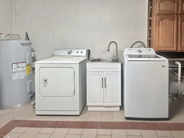a utility room with dryer and washer
