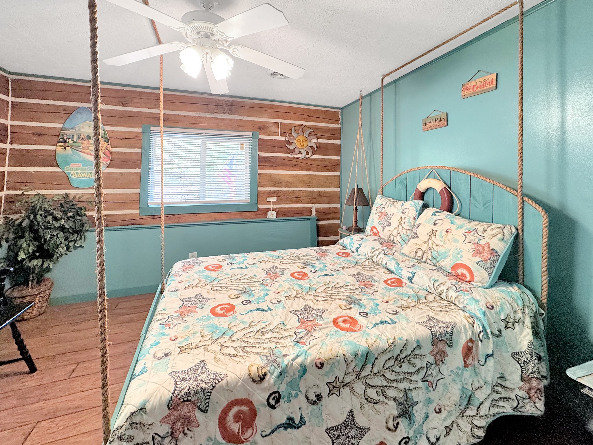 480 Hickman Shores Road Dover, TN 37058 - Photo 26 of 44 a bedroom with a bed and a chandelier