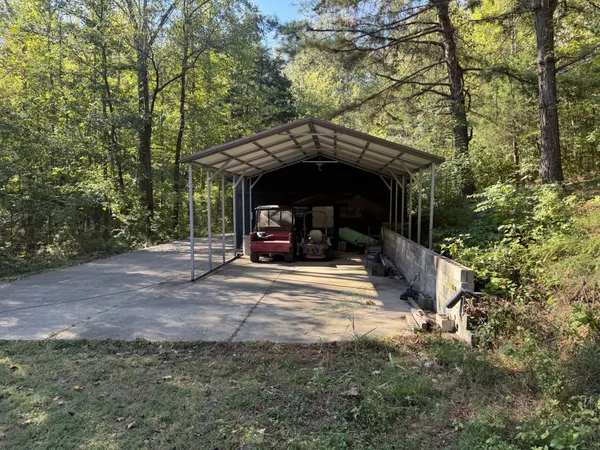 a view of a car parked in the road