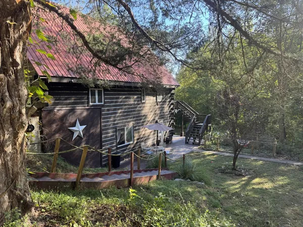 a backyard of a house with barbeque oven
