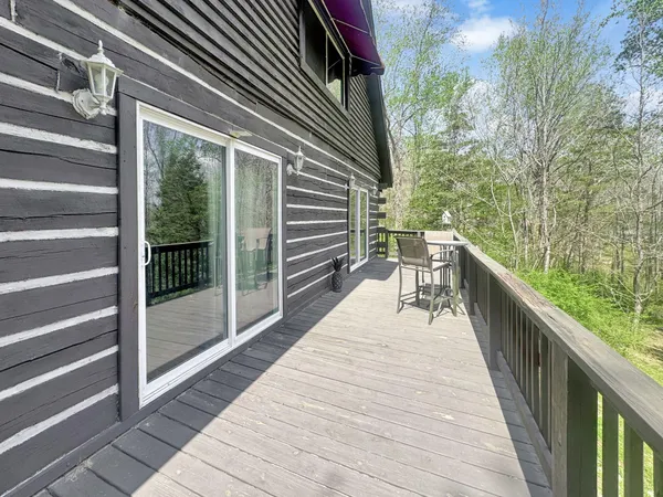 a balcony with view of outdoor space