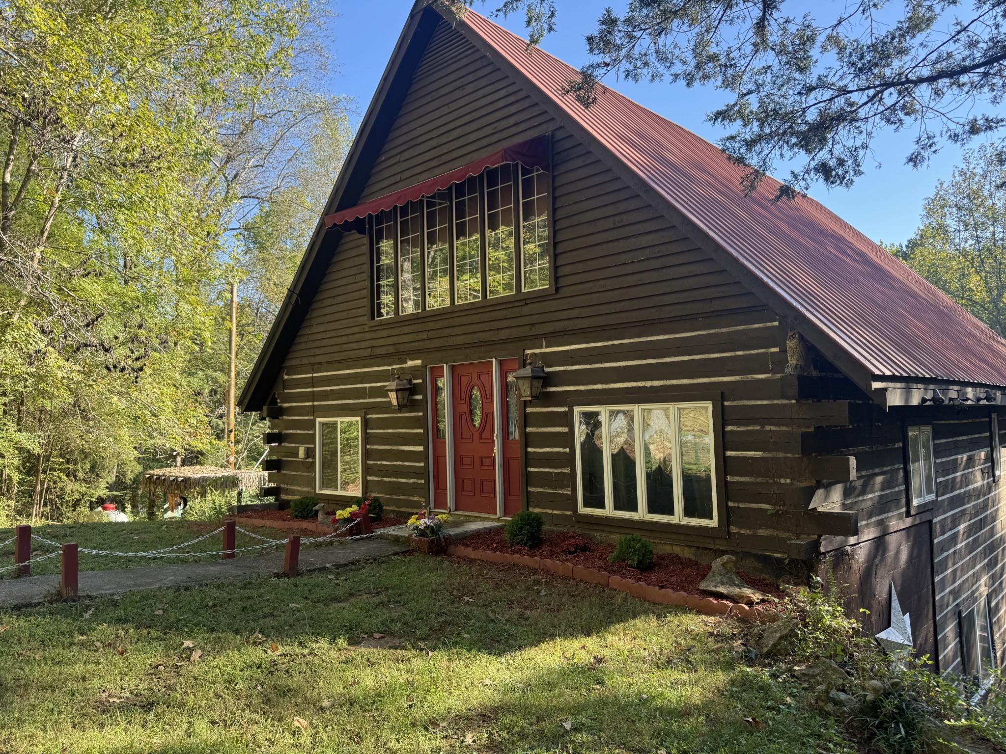 480 Hickman Shores Road Dover, TN 37058 - Photo 43 of 44 a front view of a house with garden