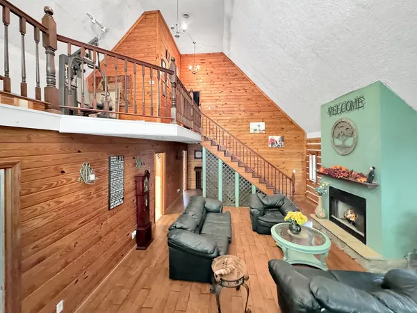 a view of a chairs and tables in the balcony