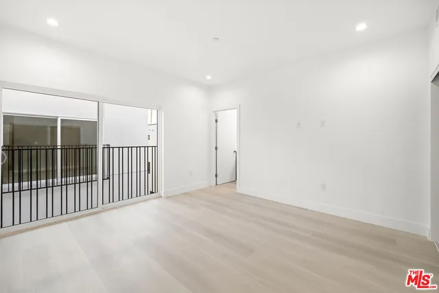 a bathroom with a double vanity sink toilet mirror and shower