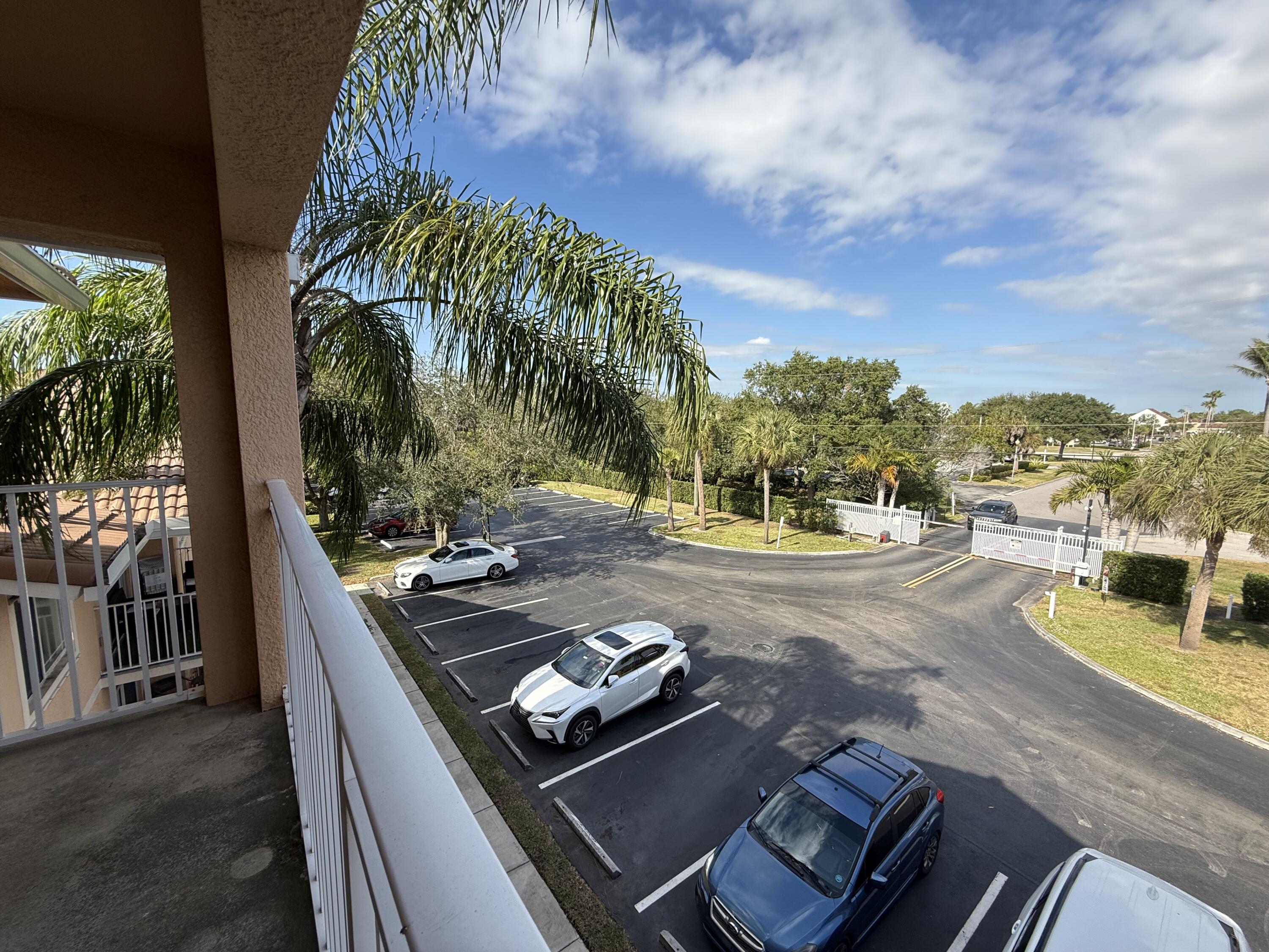 301 Southwest Palm Drive, Unit 305 Port St. Lucie, FL 34986 - Photo 17 of 17 a view of a swimming pool with a patio