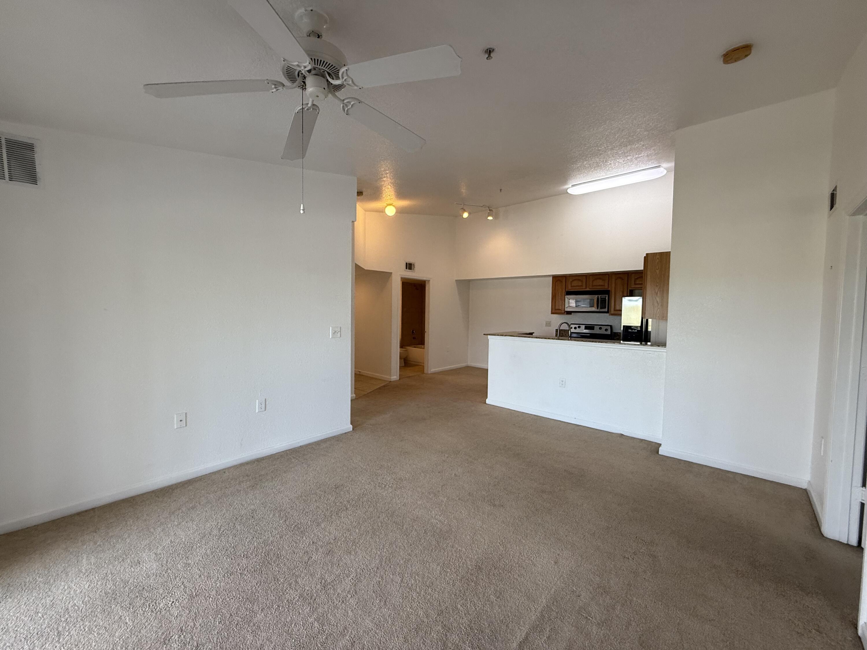 301 Southwest Palm Drive, Unit 305 Port St. Lucie, FL 34986 - Photo 2 of 17 a view of a kitchen with a sink and a stove top oven