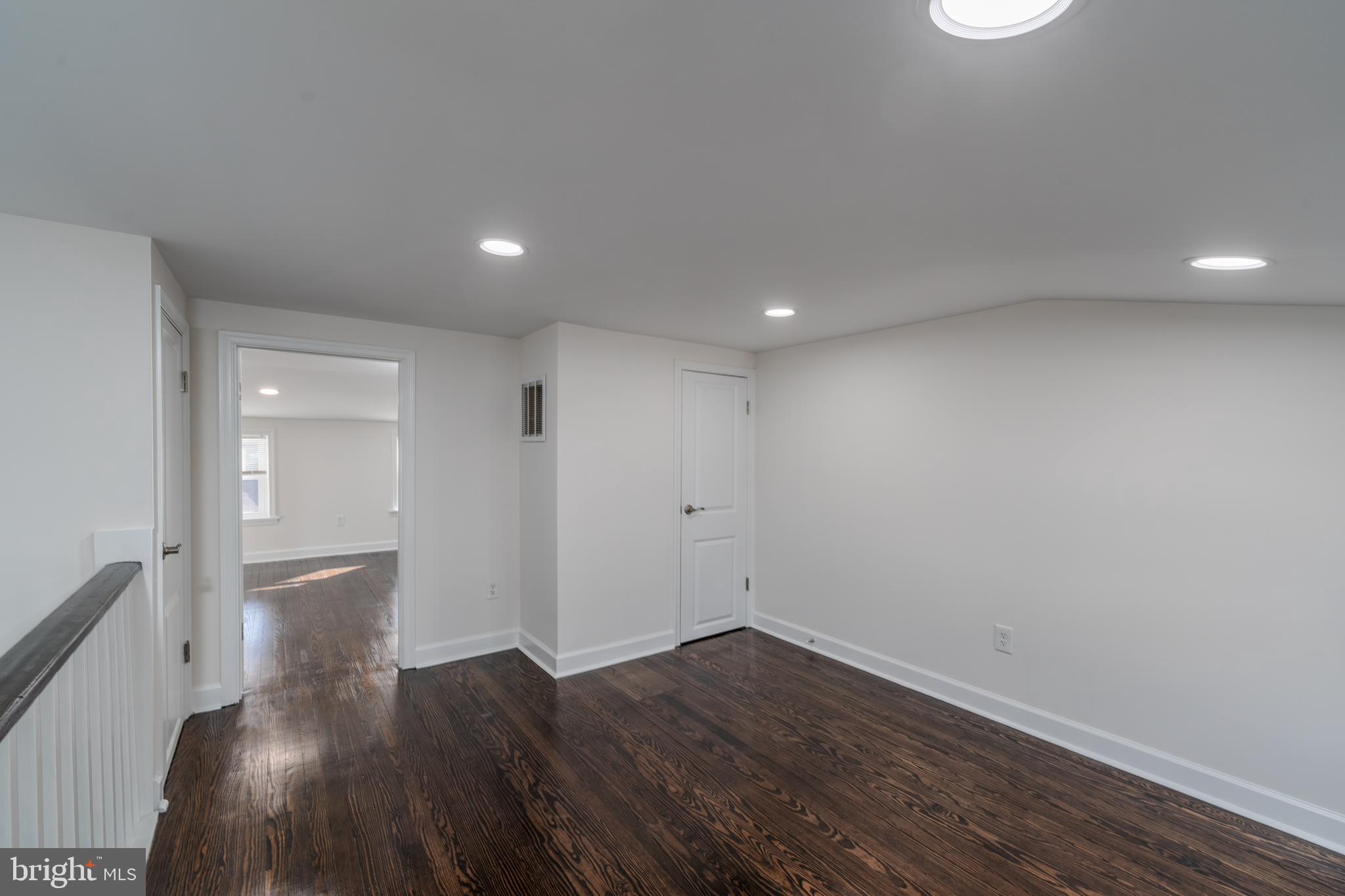 116 South Durham Street Baltimore, MD 21231 - Photo 17 of 28 a view of a hallway with wooden floor