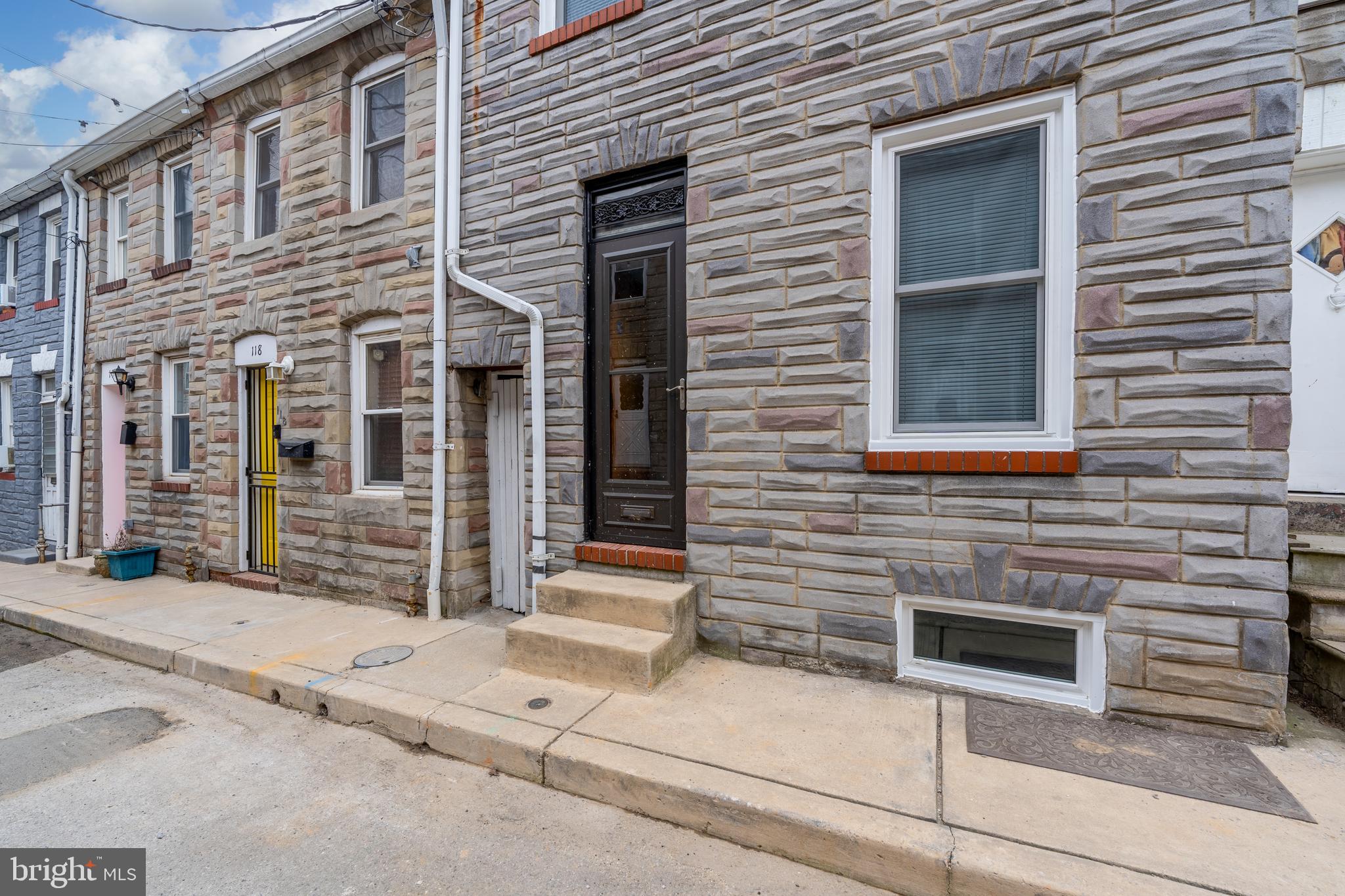 116 South Durham Street Baltimore, MD 21231 - Photo 19 of 28 a view of a brick house with large windows