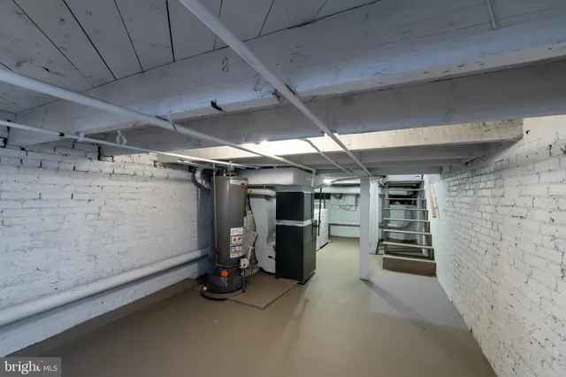 a picture of a bench in front of a wall