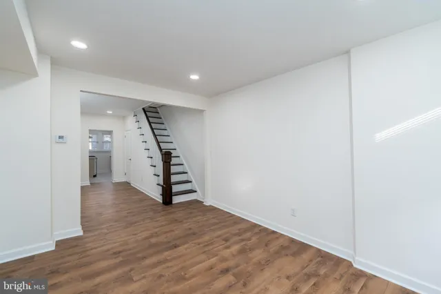 a view of an entryway with wooden floor