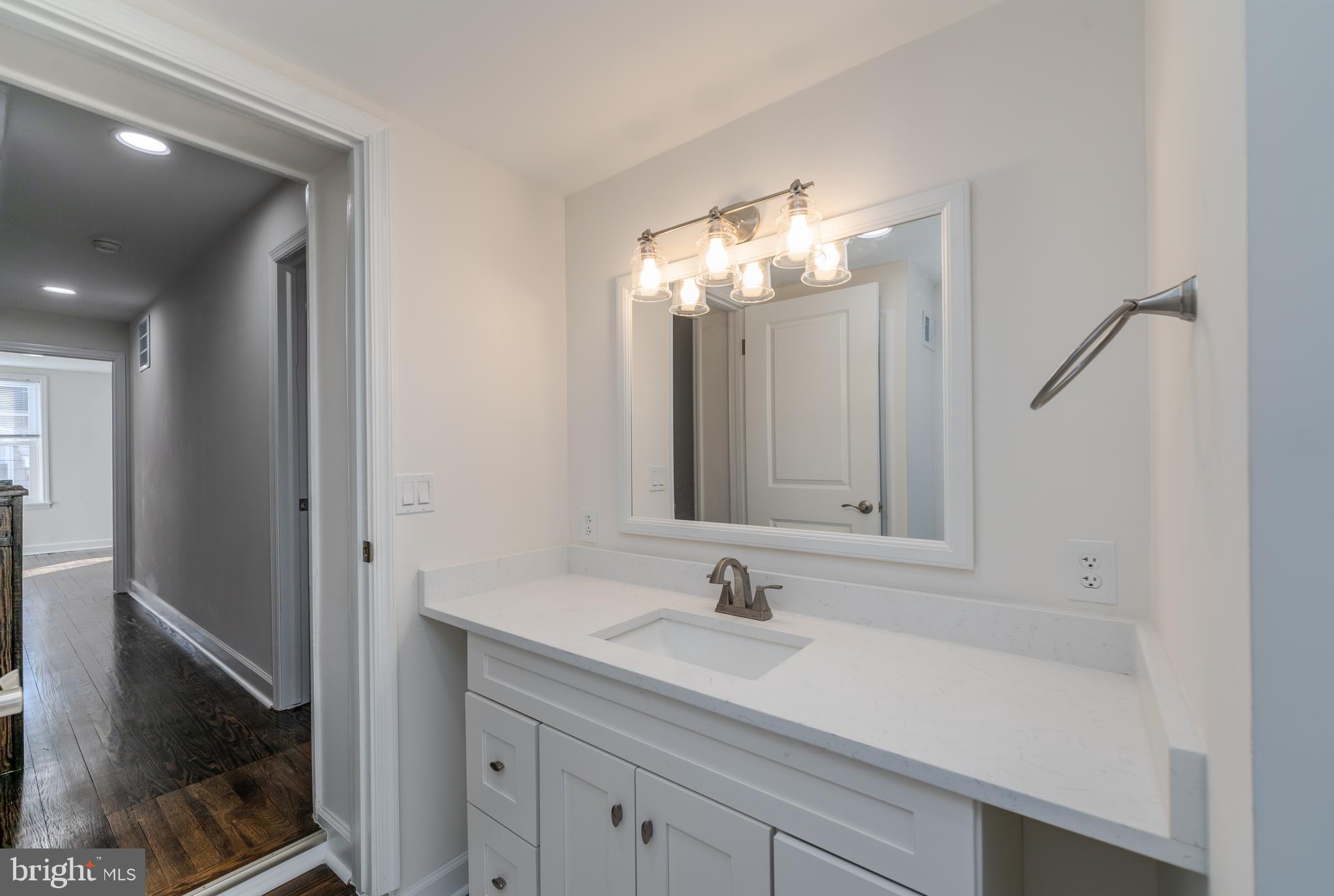 116 South Durham Street Baltimore, MD 21231 - Photo 9 of 28 a bathroom with a sink and a mirror