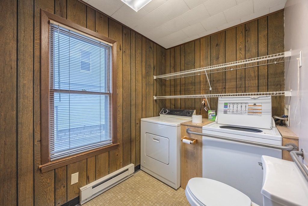 97 Oklahoma Street Springfield, MA 01104 - Photo 11 of 25 a bathroom with a sink a toilet and shower