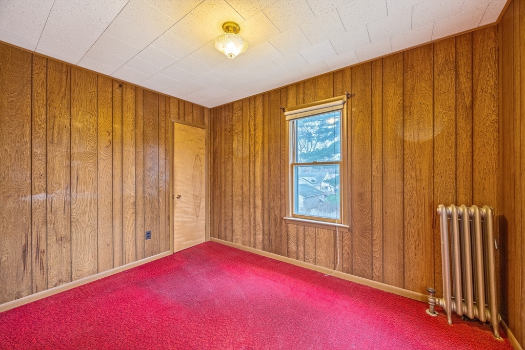 97 Oklahoma Street Springfield, MA 01104 - Photo 14 of 25 a view of an empty room with a window