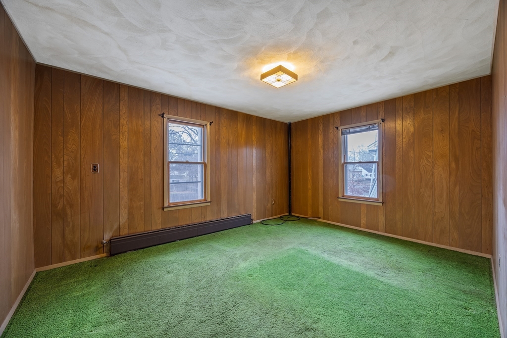 97 Oklahoma Street Springfield, MA 01104 - Photo 19 of 25 an empty room with windows
