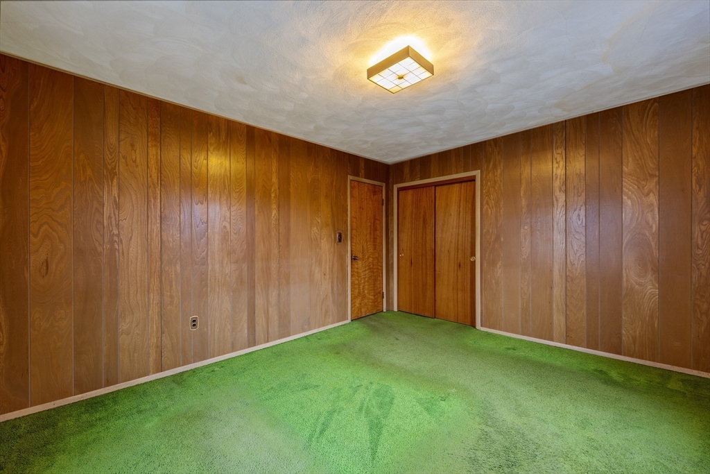 97 Oklahoma Street Springfield, MA 01104 - Photo 20 of 25 a view of empty room with a window and stairs